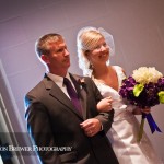 The bride and her dad walking down the aisle.